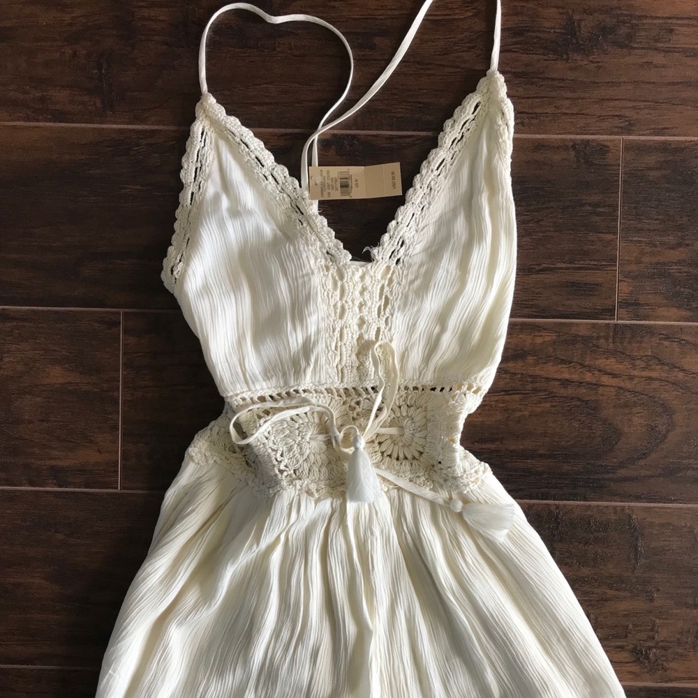 Never worn ivory romper with lace